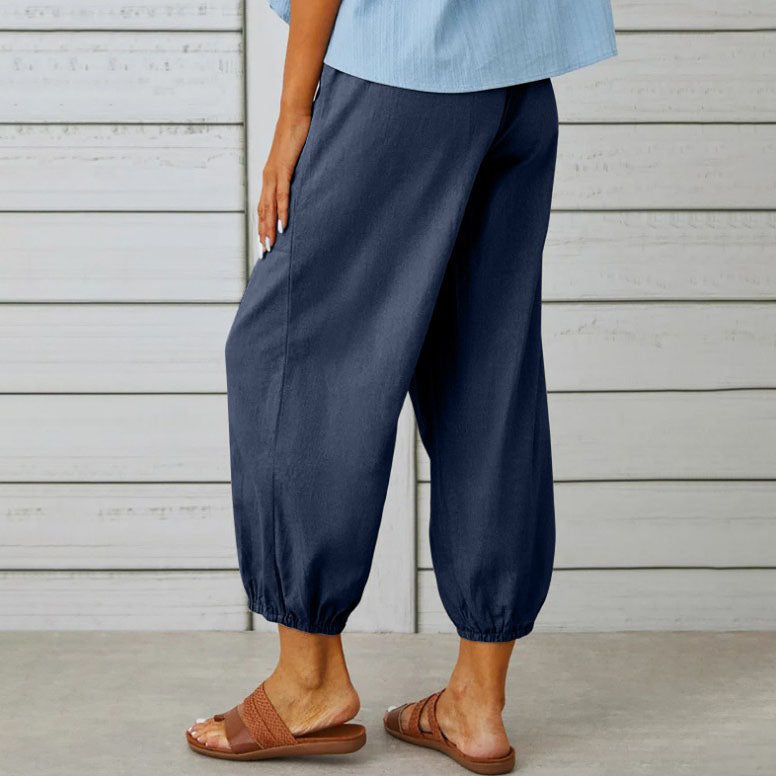 ADELLA - Pants with wide pant legs